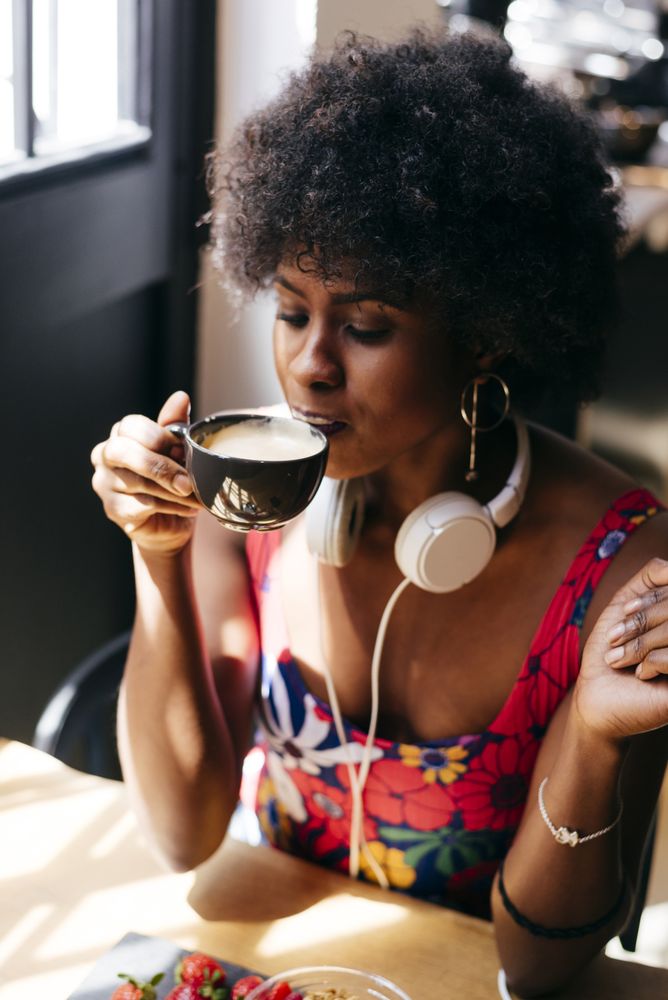 Black woman sipping coffee
