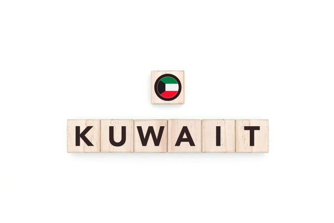 Wooden blocks bearing the name and flag of Kuwait.