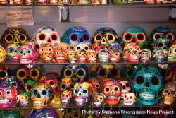 Rows of painted ceramic skulls for sale 0VGNX5