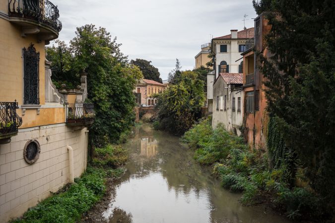 Flooded ancient street among old buildings