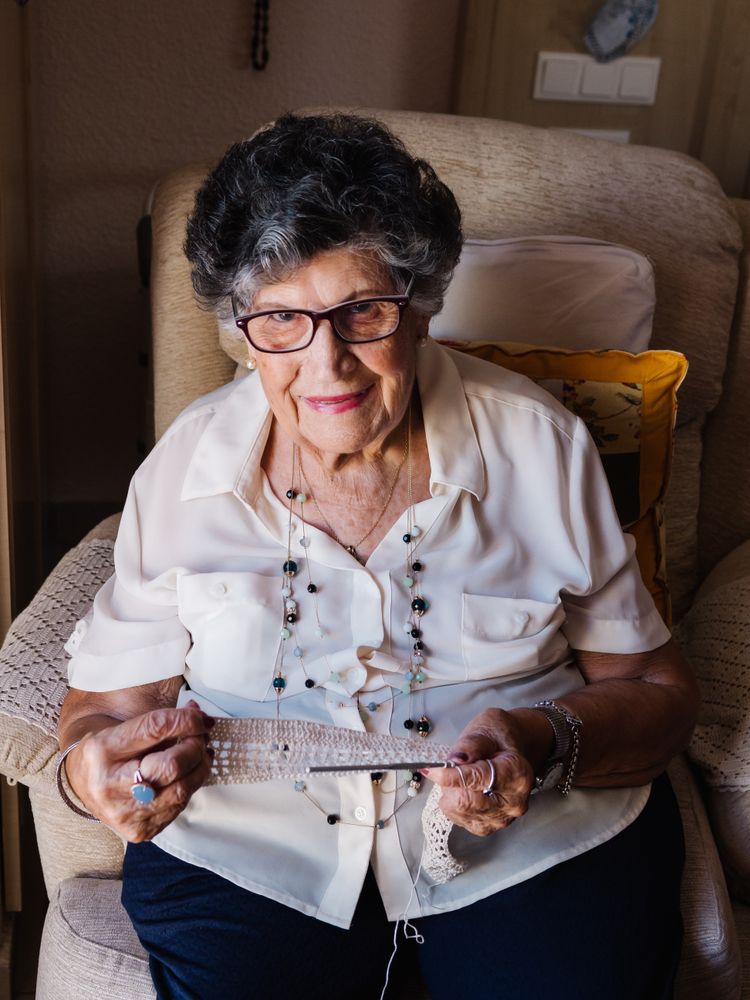 Older woman knitting crochet