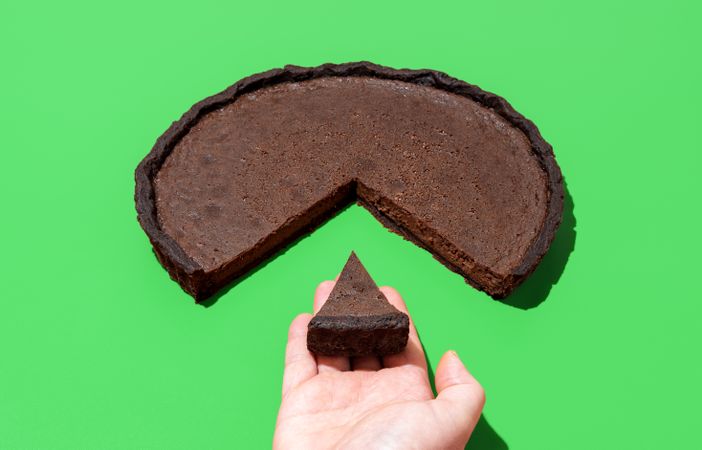 Chocolate tart isolated on a green background