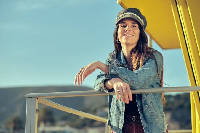 female standing on balcony on nature