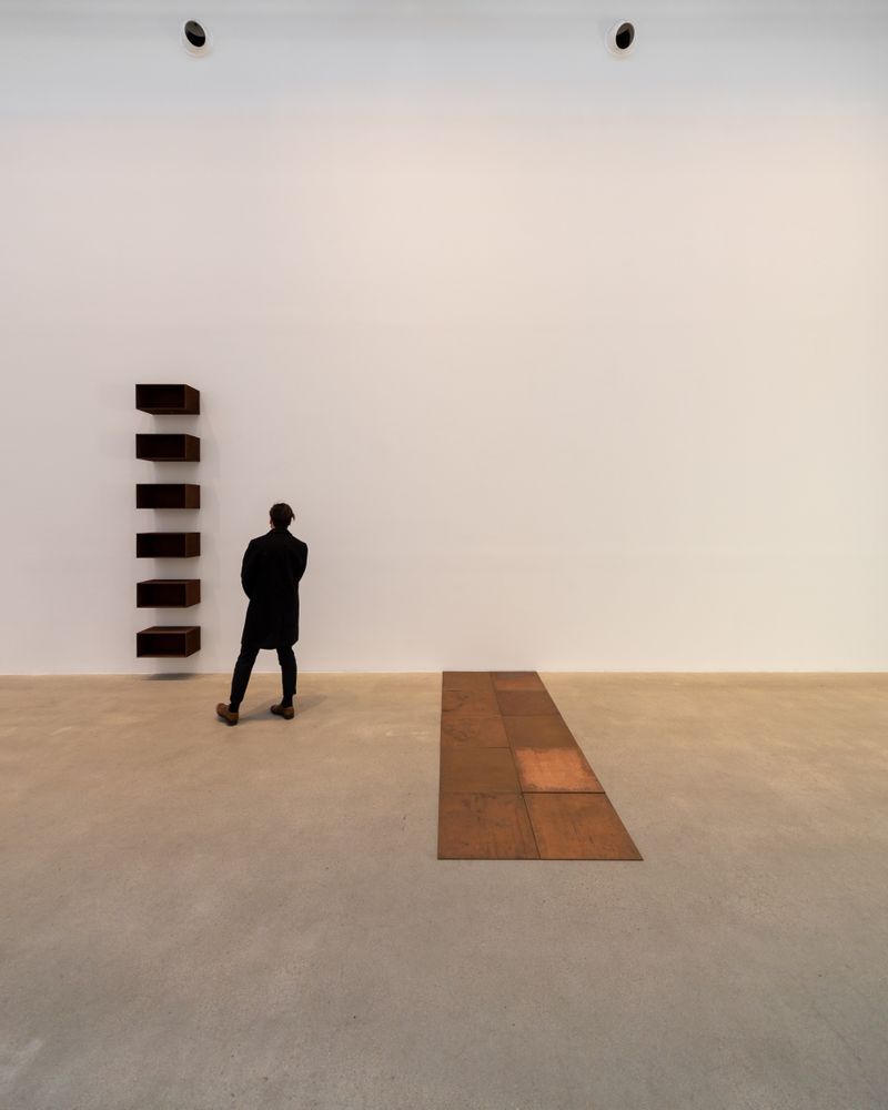 Man wearing coat in an empty room