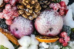 Christmas scene of snowy apples and dried fruit decorations