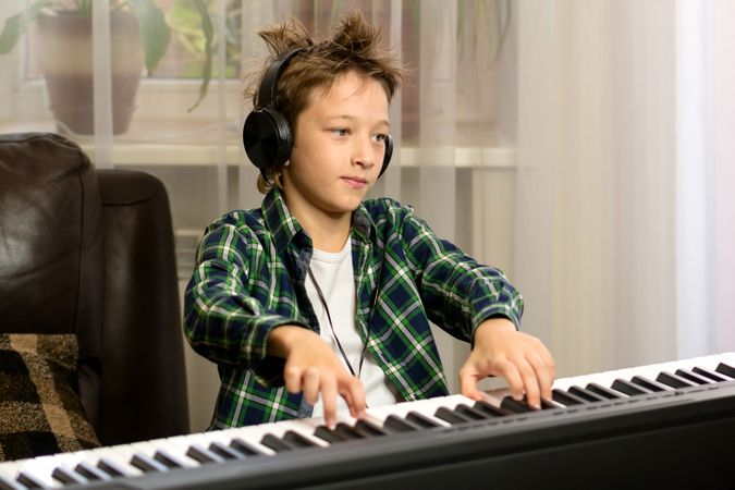 Focused Youth at Keyboard