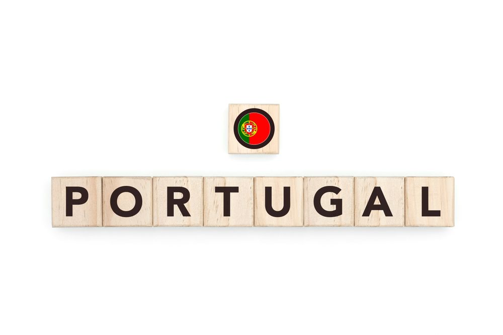 Wooden blocks bearing the name and flag of Portugal. Portuguese, Atlantic and European Culture, national identity, travel, and geography in a copy space design.