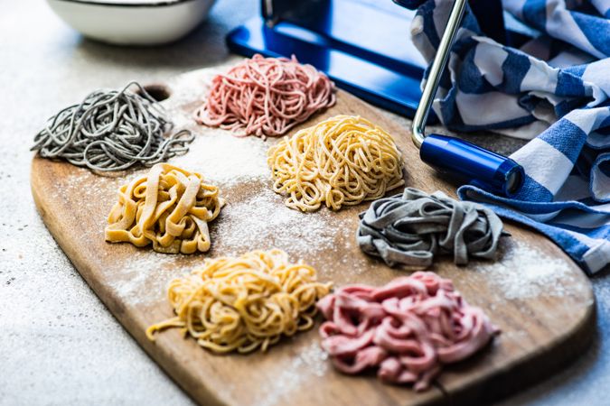 Freshly made Italian homemade pasta on wooden board