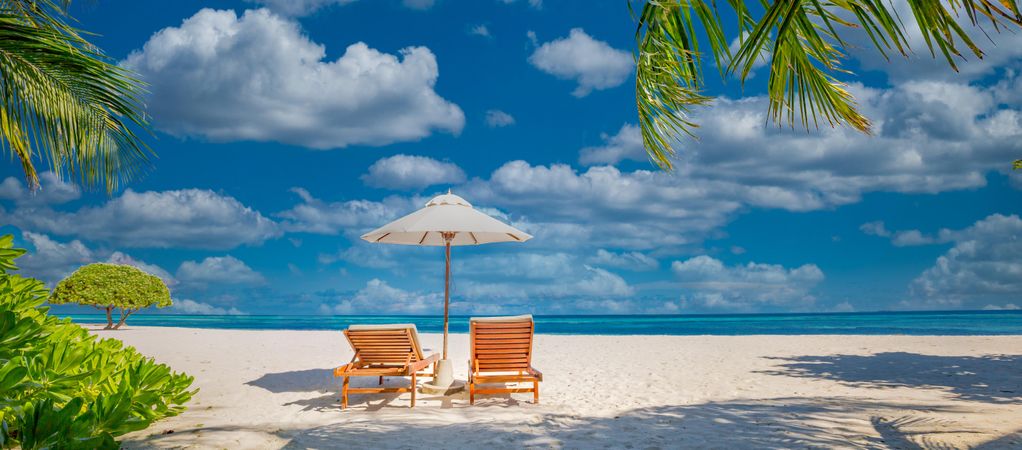 Tropical beach with lounge chairs for relaxing