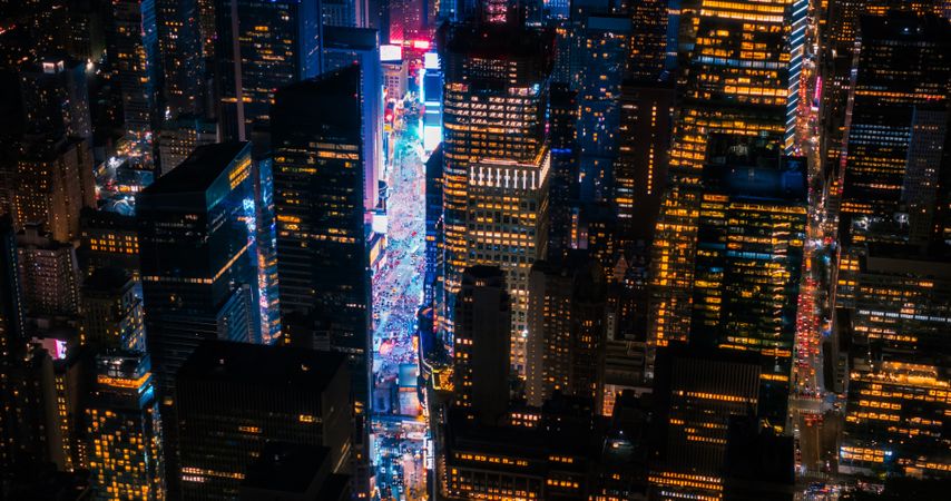 New York Concrete Jungle at Night. Aerial Shot from a Helicopter Tour Around Manhattan. Scenes with Modern Skyscraper Blocking the View on Crowded Times Square Area with Tourists