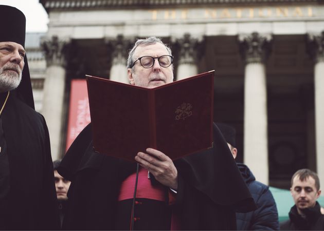 London, England, United Kingdom - March 5 2022: Catholic bishop doing a reading at a protest