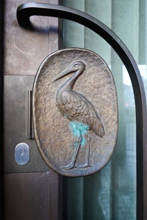 Relief of stork on door handle