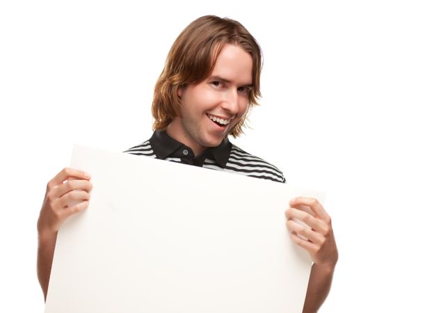 Smiling Young Man Holding Blank Board