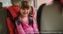 Cute girl buckled into her car seat bev830