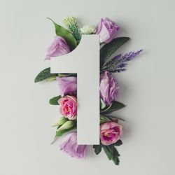 Colorful flowers, leaves and paper “1”
