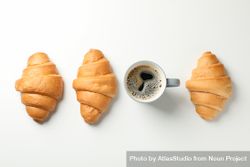 Flat lay with croissants and cup of coffee on plain background, top view bxJpB5