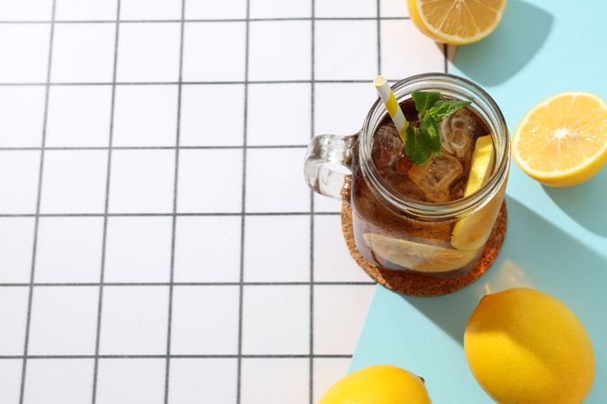 A glass of cold tea with fresh orange slices