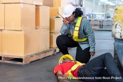 Black male in PPE gear passed out on distribution center floor 0L7GAb