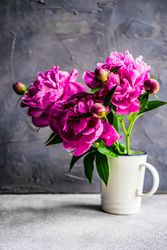 Summer interior decor with flowers in mug