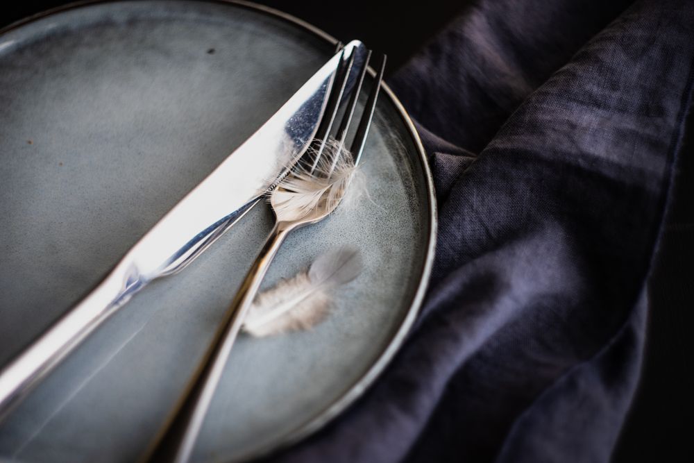 Table setting for Easter dinner with feather detail