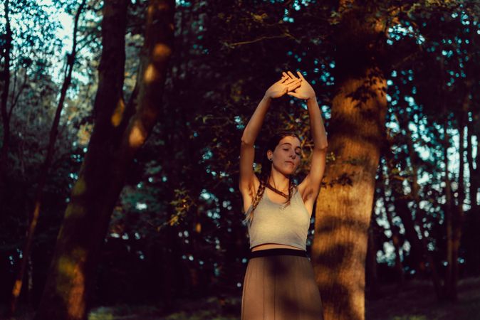 Young woman in majestic forest