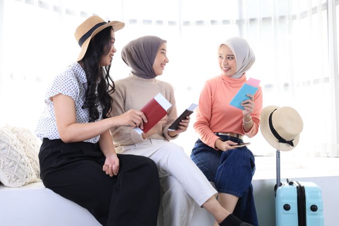 Asian Woman Friend Sitting at Home Preparing Holding Passport and Ticket for Vacation