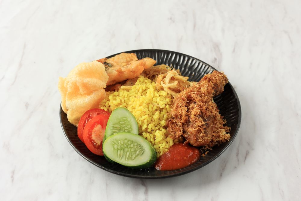 Close Up Yellow Rice with Chicken and Spiced Shredded Coconut