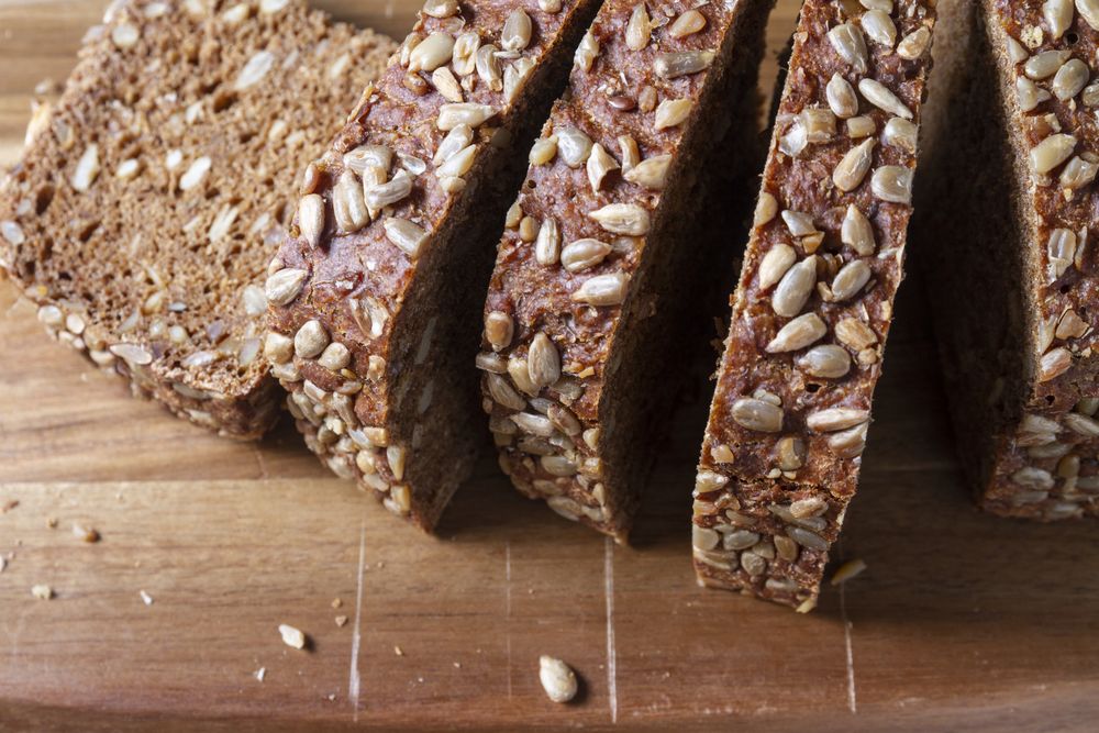 Sliced bread on wooden background