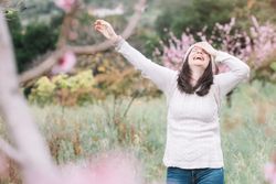 Happy woman in spring countryside