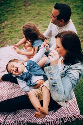 Family of four having fun at the park