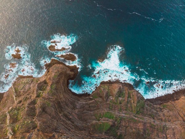 Cliffs with blue waves below