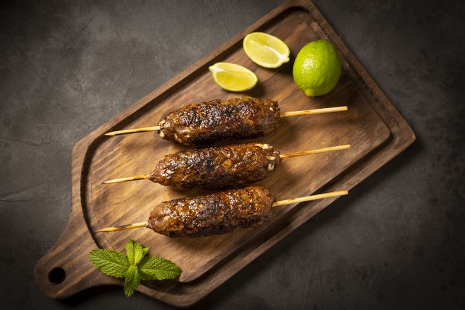 Beef kafta on the wooden board. Kafta, Traditional Arabic cuisine.