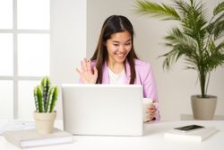 young Asian woman holding a video conference