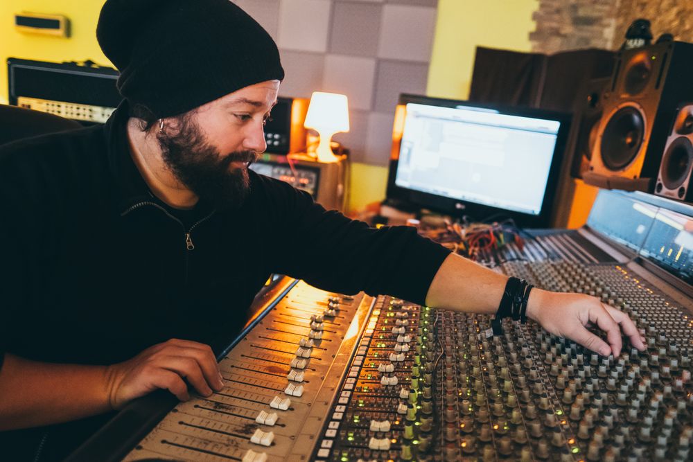 Man in a equalizer instrument in a studio