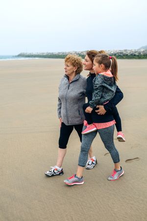 Three generations looking at the seaside