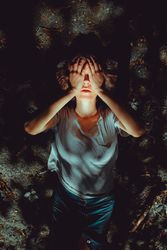 Woman lying on ground