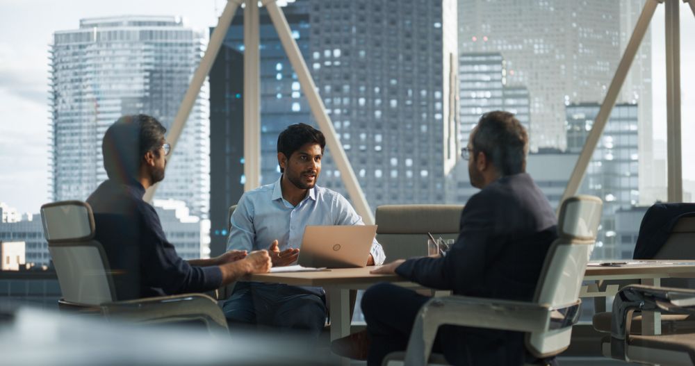 Three Young South Asian Colleagues Working in a Business Software Development Company.