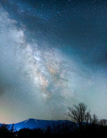 Mountains landscape under milky way sky