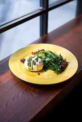 Yellow plate with healthy breakfast on wooden counter