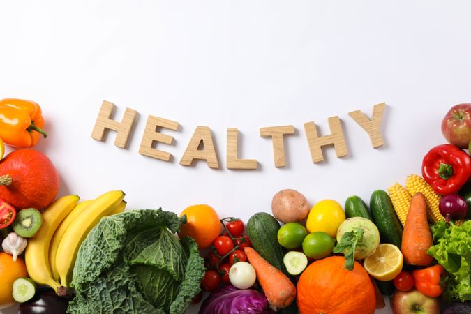 Word Healthy, different vegetables and fruits isolated on blank background