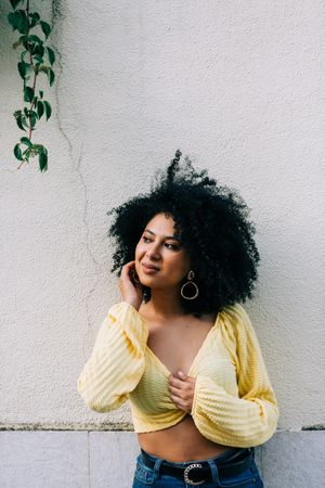 Black female standing on street