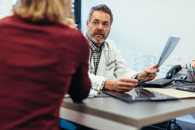 Doctor discussing medical scan result with patient