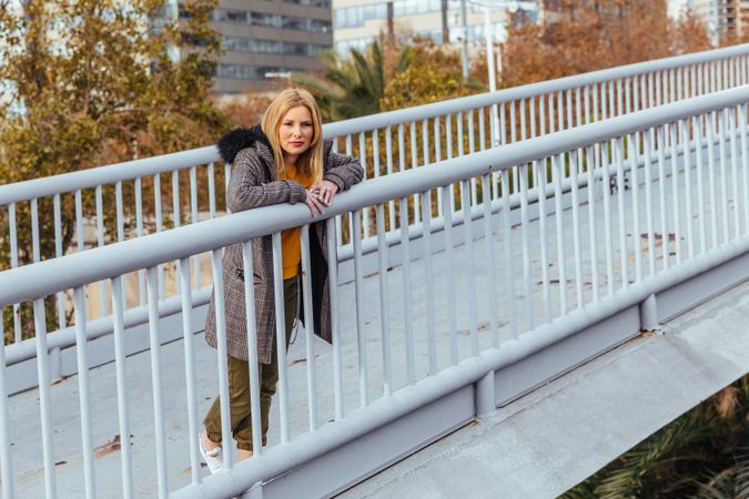 Blonde woman posing in the city