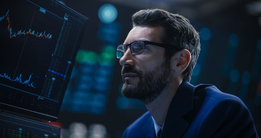 Adult Man Wearing Glasses, Researching Investment Possibilities for International Business Corporations