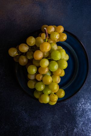 Plate of grapes on navy plate