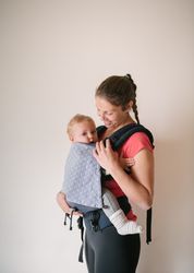 Sporty mother with baby in gym