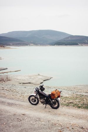 Motorcycle near calm lake