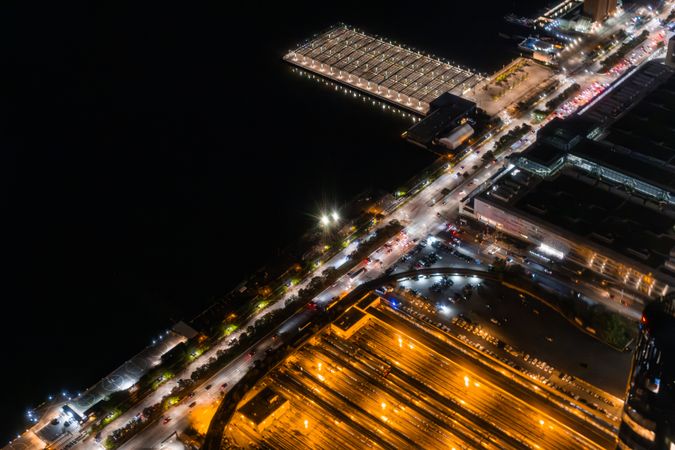 Aerial View with Industrial Docks and Railway Station with Trains. Panorama of the Area from a Helicopter, Showing Industrial Buildings, Harbour Loading Equipment