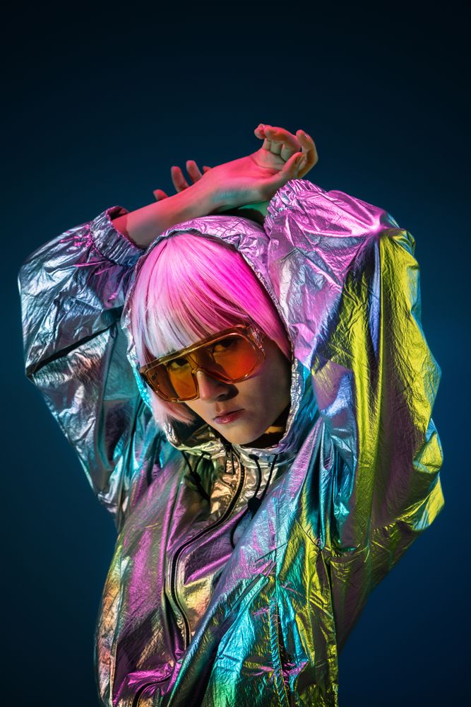 Woman standing in sparkly silver jacket