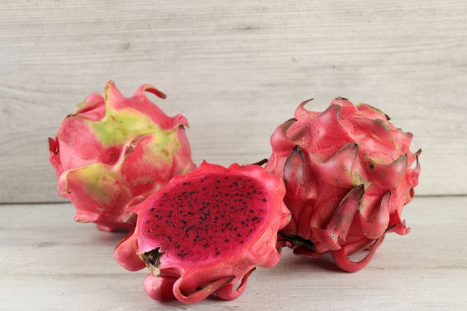 Halved Red Dragon Fruit or Buah Naga Merah on Table
